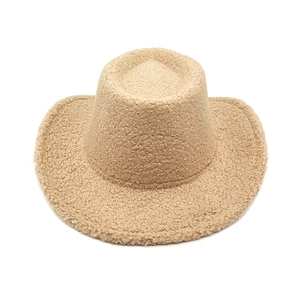 Detail of khaki sherpa western cowboy hat showing thick texture and wide brim