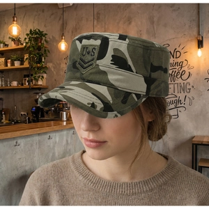 Close-up of military camouflage flat top cap with US embroidery in a vintage cafe setting