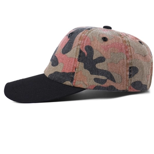 Distressed camo baseball cap with a black brim and vintage patchwork design