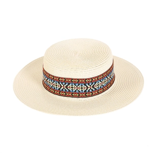 Flat top bohemian straw sun hat with colorful ethnic band on white background