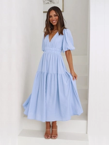 Detail of light blue V-neck puff sleeve maxi dress with tiered skirt and waist detail