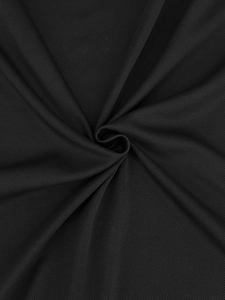 Close-up of black breathable mesh fabric with waffle pattern for summer men polo shirt