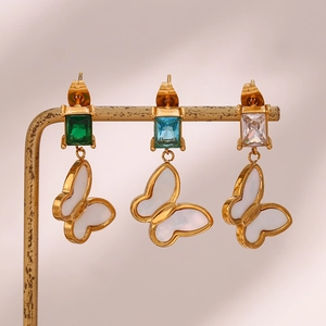 Golden butterfly drop earrings with square zircon crystals on minimalist jewelry stands