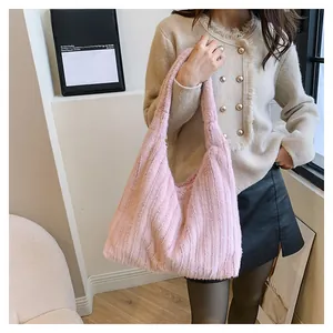 Detail view of pink plush faux fur tote bag showing soft texture and large hobo shape