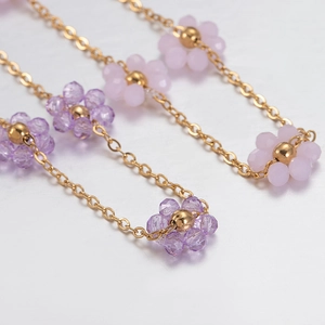 Handmade stainless steel gold chain necklace featuring purple crystal bead flower charms
