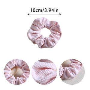 Pink waffle fabric scrunchie with 10cm diameter measurement for French retro hair styling