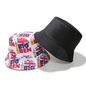 Detail of vintage bucket hats with Big Ben and British flag prints on cotton fabric