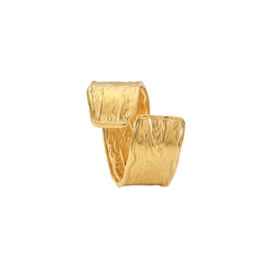 Detailed view of the 18K gold pleated texture and hammered finish on this stainless steel ring