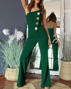 Detailed back view of a strapless dark green jumpsuit featuring large golden buttons