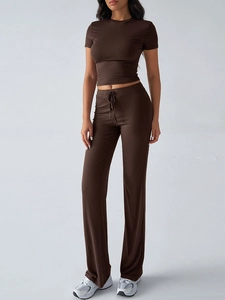 Detail of the elegant brown short sleeve top and trousers casual fashion set for women