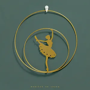 Modern golden iron wall decor featuring ballet dancer silhouette within double circular frames