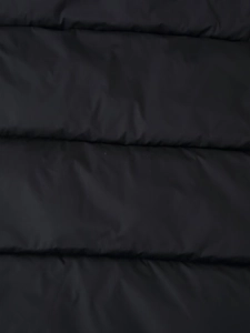 Close-up of black windproof fabric with parallel quilted stitching for puffer jackets