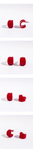 Detailed views of glossy red C-shaped hoop earrings with minimalist enamel finish