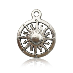 Macro view of silver vintage sun pendant with top loop and soft reflection on white background