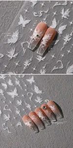 Detailed relief nail art stickers featuring white butterflies and starry patterns