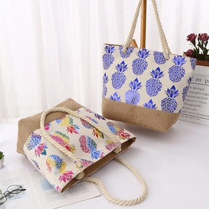Canvas tote bag with tropical pineapple print, jute bottom, and sturdy cotton rope handles