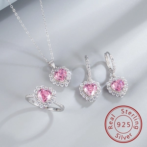 Macro detail of S925 sterling silver jewelry set featuring pink heart carbon diamonds
