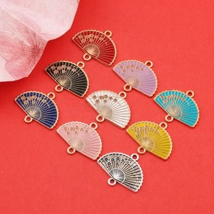 Group of fan-shaped zinc alloy plum blossom charms in nine colors on red background