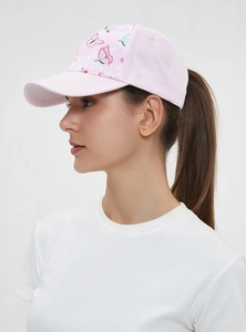 Close-up of pink ponytail baseball cap with colorful butterfly and floral patterns