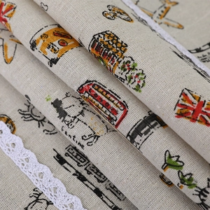 Macro detail of linen fabric with British prints and delicate white lace trim