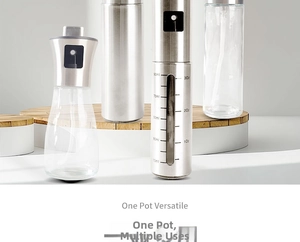 Detail view of kitchen oil sprayer bottle with glass body and clear ml measurement scales