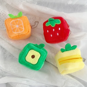 Set of four plush fruit coin purses featuring orange, strawberry, avocado, and pineapple shapes