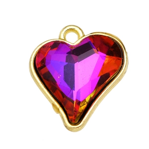 Detailed view of faceted heart pendant with gold frame and purple to red-orange gradient