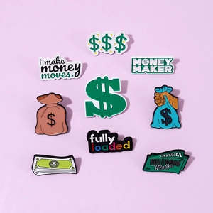 Macro detail of alloy money maker enamel pins set with coins and dollar bills design