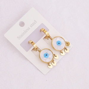 Detailed close-up of golden stainless steel evil eye earrings with heart pendants