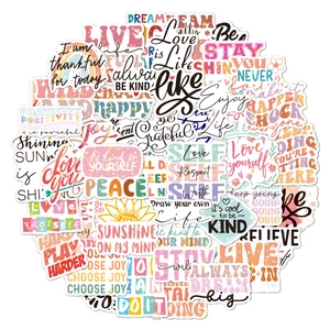 Close-up of holographic vinyl stickers featuring inspirational quotes and floral designs