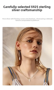 Detail view of s925 silver thread earrings with natural baroque pearls on model