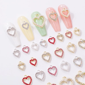 Hollow heart nail charms with rhinestones and pearls for Y2K style manicure decoration