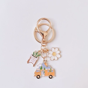 Floral camper van keychain with daisy charm and crazy plant lady message pendant