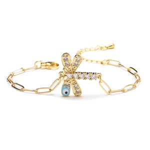 Golden dragonfly charm bracelet with evil eye detail and paperclip chain style