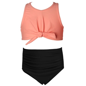 Two-piece girls swimsuit with coral pink tie-front top and high-waisted black bottoms