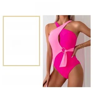 Close-up of pink color-block swimsuit with side gold ring detail and waist ties