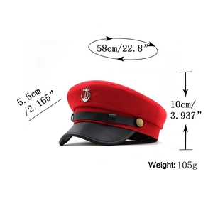 Detail view of red beret with silver anchor decor and specific size measurements
