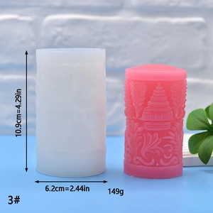 Detail of cylindrical silicone mold with pink oriental architecture relief candle product