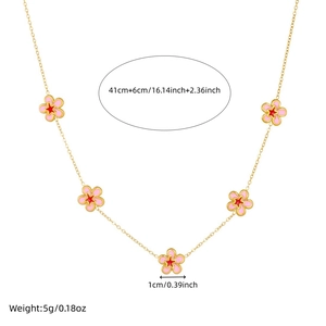 Detail view of a gold chain necklace with pink flowers and specific size measurements