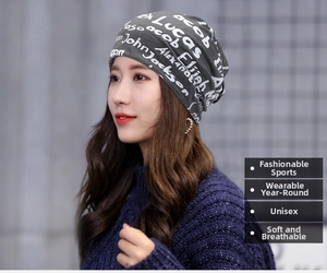 Close-up of soft breathable dark gray slouchy beanie with white handwritten typography print