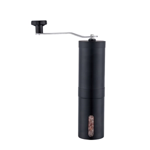 Portable manual coffee grinder in matte black with stainless steel handle and clear window