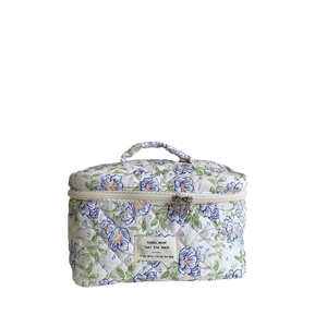 Floral cotton quilted makeup bag with large capacity, top handle, and zipper closure