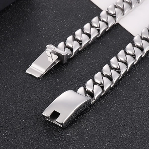 Detailed close-up of 12mm silver stainless steel Cuban link chain with a square buckle clasp