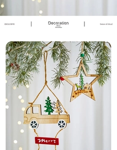 Detail of wooden star ornament with reindeer carvings hanging on festive pine branches