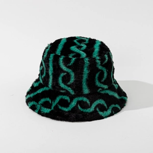 Close-up of fluffy striped bucket hat showing soft faux fur texture in green and black