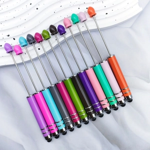 Detail of multi-color retractable pointer pens with stylus tips on white background