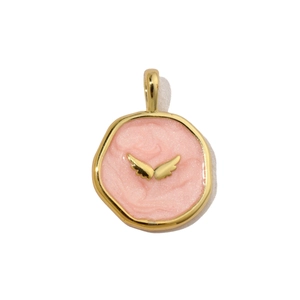 Detail of a pink enamel angel wing pendant with golden metallic border and pearlescent finish