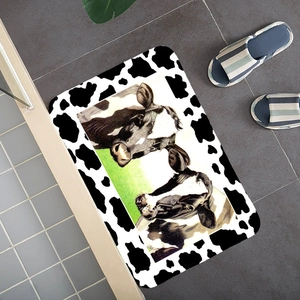 Vintage cow print absorbent floor mat with black and white spots and pasture illustration