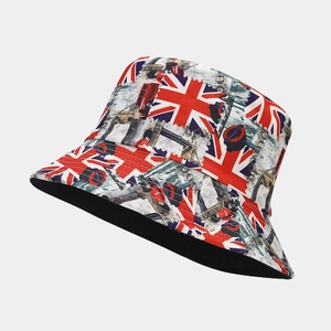 Detail of Union Jack bucket hat featuring London bus and Tower Bridge prints