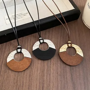 Retro geometric necklace with hammered metal and wood pendant on adjustable wax rope